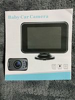 Retail sleeve showing monitor and camera, Baby Car Camera branding