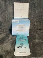 Stacked packaging of ultrasonic cleaner, silicone case and removal tool pouch