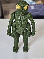 Front standing view of Ovion figure