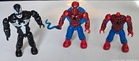 Group view of Venom and two Spider-Man minifigures