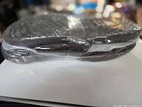 Side view of sealed pair of sandals