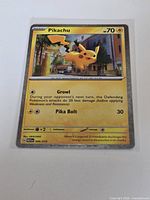 Front view of sleeved Pikachu holo card