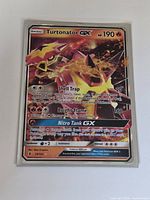 Front view of sleeved Turtonator GX card showing artwork and text