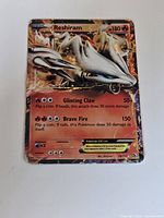 Front of Reshiram EX card showing artwork, stats and HP