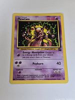 Front view of Mewtwo Black Star Promo card showing artwork, text, HP and moves
