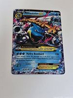 Front of Mega Blastoise EX card on white background