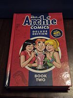 Front cover showing title, characters, Book Two label