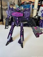 Front view of Shockwave figure standing with cannon attached