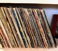 Side view of full shelf showing the bulk of vinyl LP records
