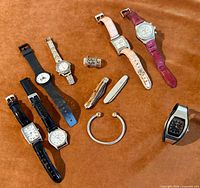 Group view of all watches, ring, bracelet, pocket cutter
