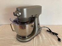 Full view of GE stand mixer with bowl, splash shield and power cord