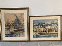 Both framed watercolours side by side