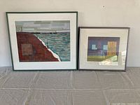 Both framed prints side by side