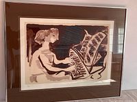 Full view of framed limited edition print depicting pianist