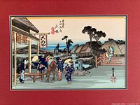 Full view of framed Hiroshige woodblock print with red mat