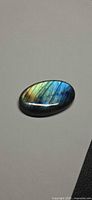 Front view of oval labradorite showing flash