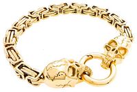 Full view of gold-plated skull bracelet with ring clasp