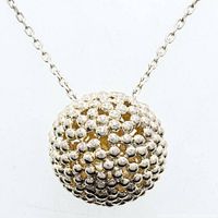 Full view of sterling silver necklace showing chain and bead ball pendant