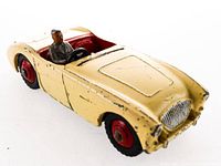 Front three-quarter view showing overall model, body colour, driver figure, and wheel style