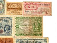Fronts of several notes including Austria 100 Kronen, US MPC 5 Cents, Russia 20 Rubles