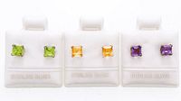 Front view of three display cards with peridot, citrine and amethyst stud earrings