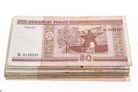 Stack of 50-ruble Belarusian notes showing front design, serials