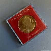 Medal in case, obverse portraits visible