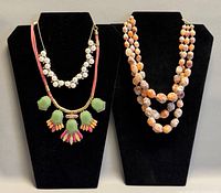 Two necklace display stands showing all three necklaces together