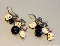 Full view of both earrings showing bead arrangement and ear wires