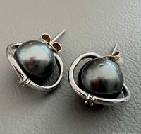 Front view of both earrings showing pearls and white gold setting