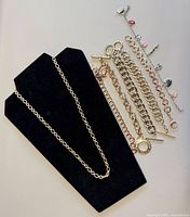 Necklace and six bracelets laid out