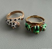 Both rings side by side on grey surface