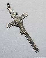 Full view of metal crucifix pendant