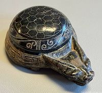 Top view of black jade dragon turtle showing hexagon-patterned lid