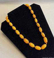 Full necklace on display bust showing overall length and bead arrangement