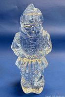 Front view of clear glass figurine showing full form and detail