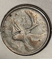 Reverse side showing caribou and date 1954