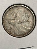 Reverse showing caribou design of 1955 Canadian quarter