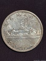 Reverse side showing Voyageur design and 1965 date