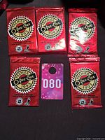 Five sealed red foil 1993 O-Pee-Chee Premier packs displayed together