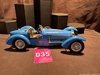 Left side view of blue Bugatti Type 59 diecast model