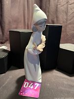 Full view front left of figurine showing overall form and height