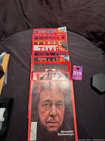 Stack of red-border Time magazines, Alexander Solzhenitsyn issue on top