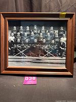 Full view of framed photo in wood frame