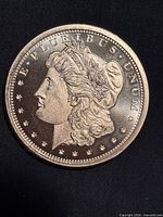 obverse showing Morgan Dollar design