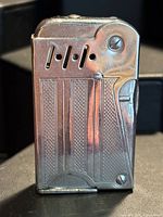 Front view showing textured chrome body and vent slots