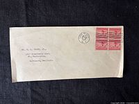 Full envelope front showing address and pair of stamps