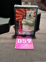 Front of sealed Coca-Cola Polar Bear playing card deck showing polar bear artwork and lot tag 059