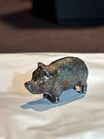 Front three-quarter view of cast iron pig