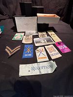 Overview of box, photographs, patches and ephemera